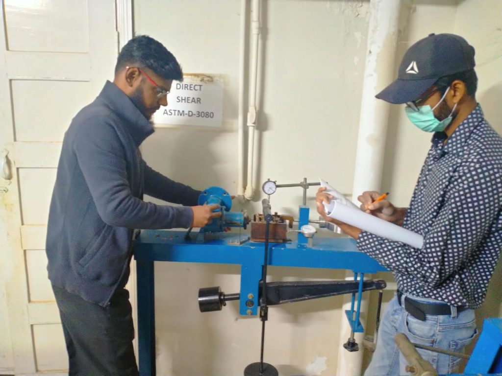 BNB technicians performing Direct Shear Test for our client at Bahria Town